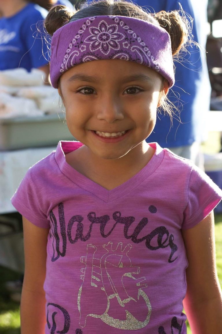 Sotelos Family youngest daughter smiles towards camera